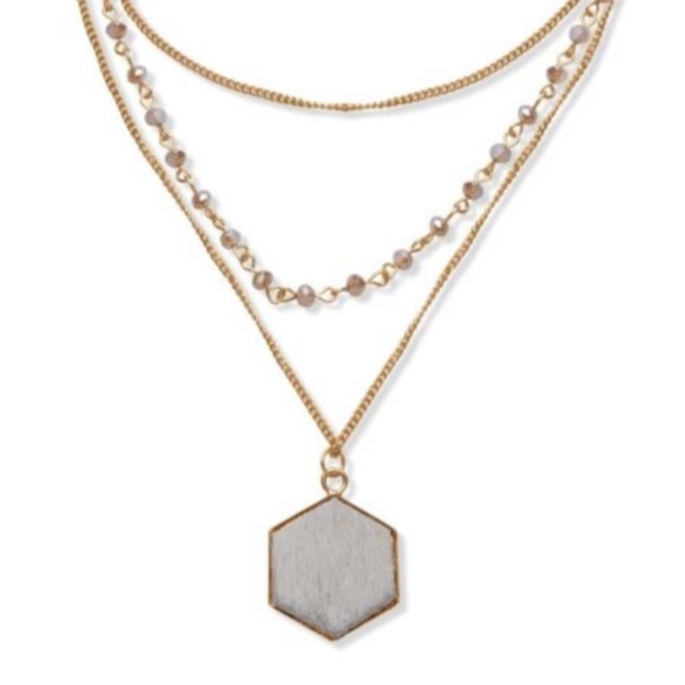 Triple strand golden necklace, leather pendant